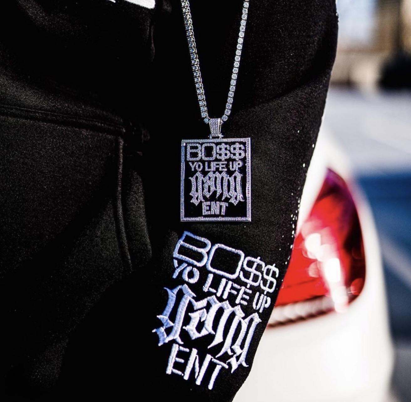 Archival social image showing BYLUG apparel and a matching pendant